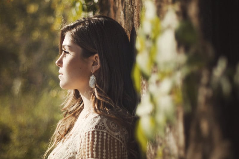 Girl Leaning on Tree